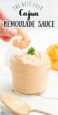 the best ever cajun remoulade sauce in a glass jar with a spoon