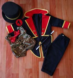 an outfit and hat are laid out on the floor