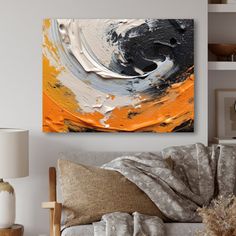 an abstract painting on the wall in a living room