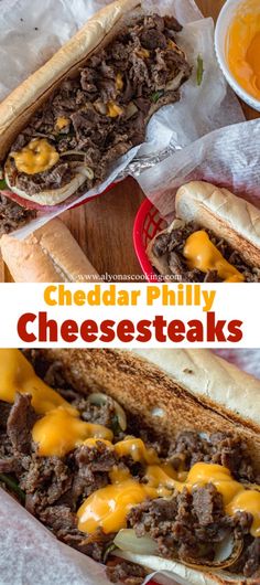 two cheese steak sandwiches on buns with ketchup and mustard