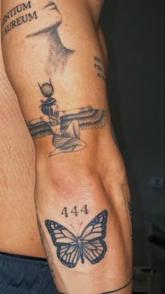 a man's arm with tattoos on it and a butterfly tattoo on the side