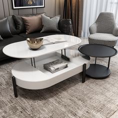 a living room with two black and white chairs, a coffee table and a couch