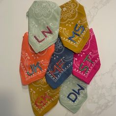 six bandannas with the letters n and d on them