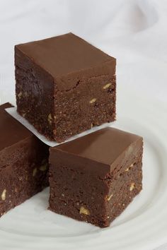 three pieces of brownie on a white plate