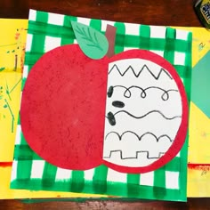 a paper plate with an apple on it