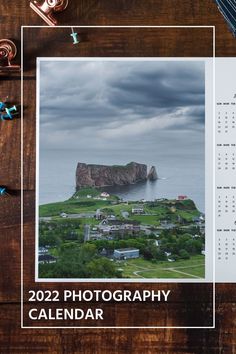 a calendar sitting on top of a wooden table