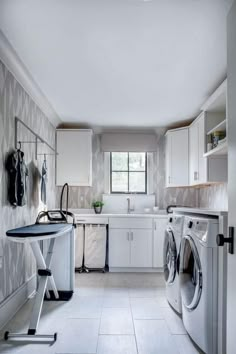 a laundry room with washer and dryer in it