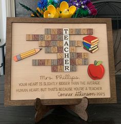 a crossword puzzle with an apple, pencils, and crayons on it