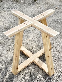 a small wooden table sitting on top of a cement ground