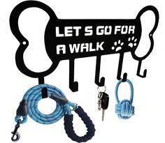 there is a leash and key holder attached to the dog's leash hanger