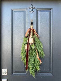 a wreath hanging on the front door of a house