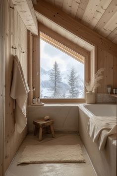 a bath room with a large window and a bench