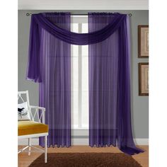 the purple curtains are hanging on the wall