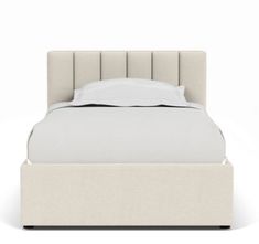 a bed with a white linen headboard and foot board on it's side