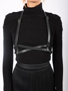 The Hiastee MNML Harness in Black by Aumorfia. Made from genuine cowhide leather with a vegetable tanned finish, this hand-stitched body harness features raw edges and hypoallergenic metal buckles for a sleek and comfortable fit. This style of body harness features a choker that runs to a waist belt. Handmade in Greece by their local craftsmen. Straps width: .5" SM-L fits neck 11.8" - 13.8" & waist 23.6" - 35.4"L-XXL fits neck 13.7" - 15.7" & waist 35.4" - 47.2" Shoulder Harness, Casual Goth, Body Harness, Leather Harness, Leather Cleaning, Metal Buckles, Winter Wardrobe, Waist Belt, Hand Stitched