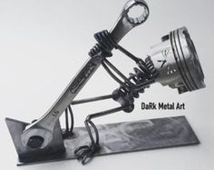 a metal sculpture with a light on it's side and the words dark metal art written below