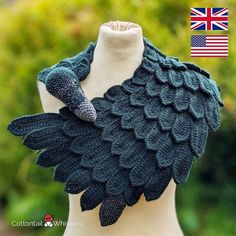 a knitted shawl with leaves on it and an american flag in the background