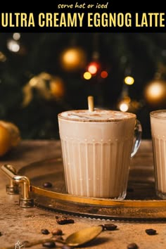 two glasses of creamy eggnog latte on a tray