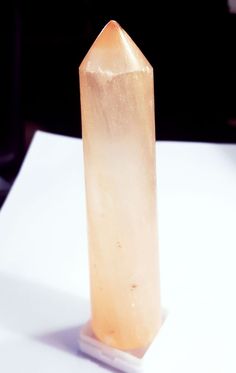 a large piece of rock sitting on top of a white table