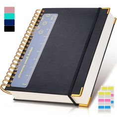 a black notebook with gold trim is open