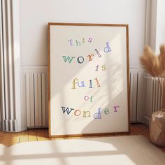 a framed poster with the words'this world is full of wonder'on it