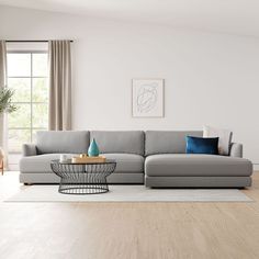 a modern living room with white walls and wood floors