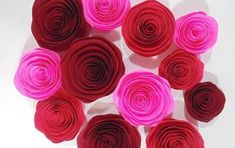 red and pink paper flowers arranged in a circle