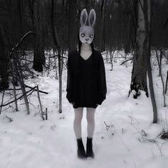 a person wearing bunny ears standing in the snow