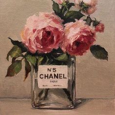 a painting of pink roses in a glass vase with the number 5 chanel label