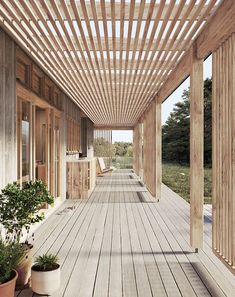 an outdoor covered porch with potted plants and wooden slats on the side wall