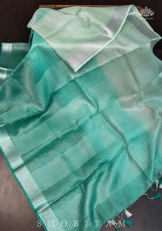 green and white handloom cotton saree with silver zari work on the border