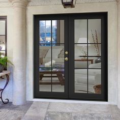 a black double door with glass on the outside