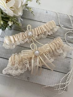 Ivory Lace Wedding Garter, Ivory Garter Set, Wedding Bridal Garter, Garter for Bride, Ivory Garter, Lace Garter Set Beautiful garter in ivory lace and a pearl accent Sale is final, but 100% satisfaction guaranteed. Please contact us if there are any issues with your purchase. Cream Lace For Wedding Night, Fitted Cream Lace For Wedding Night, Cream Lace Wedding Dress For Bride, Beige Wedding Lace With Lace Trim, Cream Lace Wedding Dress For Wedding Night, Cream Lace Bridal Accessories For Wedding, Fitted Cream Lace For Ceremony, Cream Lace Wedding Dress For Ceremony, Elegant Cream Lace For Wedding