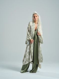 This airy kimono, with its intricate print, evokes a sense of wanderlust and adventure--perfect for resort getaways or dinners with stunning vistas. Match the soothing green hue with our earthy bohemian sets. FEATURES: Relaxed kimono-style jacket with pockets. Please note, this piece is unlined and designed without closures for a laid-back fit. 100% Handmade. SIZE & FIT: Fit: Relaxed fit with room to move The model is wearing size Small or S/M View our SIZE CHART before ordering MATERIALS & CARE Earthy Bohemian, Kimono Style Jacket, Printed Kimono, Mode Kimono, Jacket With Pockets, Stocking Fillers For Her, Print Kimonos, Locker Room, Mens Jewelry Bracelet