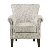 an upholstered chair with studding on the arms