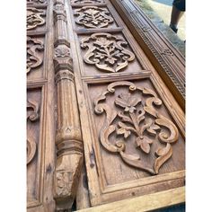 an old wooden door with carvings on it