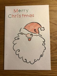 a christmas card with a santa clause drawn on it