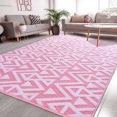 a pink area rug in a living room