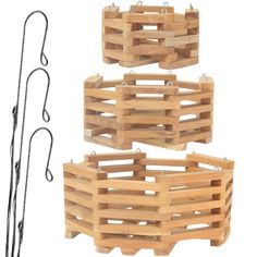 two wooden crates with hooks attached to them and one is holding a pair of scissors