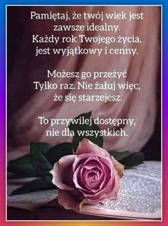 a pink rose sitting on top of an open book with words written in russian and english