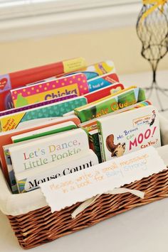 a basket filled with books sitting on top of a table