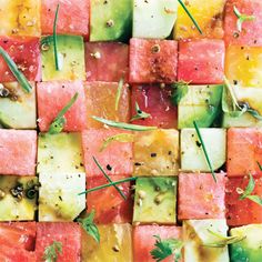 watermelon and apple cubes with herbs on them