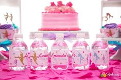 pink and gold birthday party decorations with water bottles