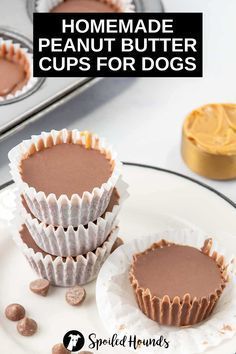 three homemade peanut butter cups for dogs on a plate next to some cupcakes