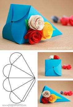 an origami flower bouquet made out of paper and rolled up in the shape of a envelope