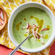 a white bowl filled with broccoli and radishes on top of a table