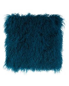 a dark blue pillow on a white background with some fluffy fur around the edges,