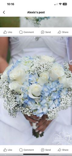 a wedding bouquet with white roses and baby's breath is displayed on the web page