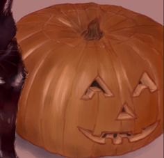 a black cat sitting next to a carved pumpkin