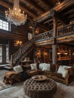 a living room filled with lots of furniture and a chandelier hanging from the ceiling